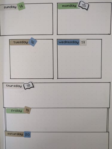 Customer's weekly planner showing Cozy Bookworm date dot stickers tilted on the daily boxes from Sunday the 14th to Saturday the 20th.