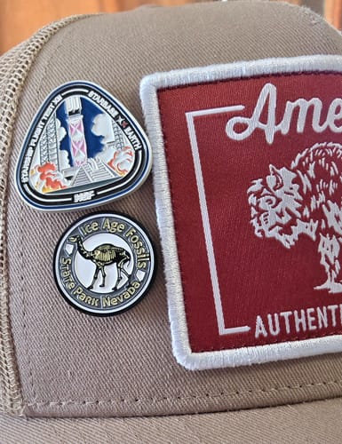 Customer's Starship Flight 12 - Collectors Pin shown pinned to the front of a tan hat.
