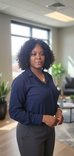 Reviewer wearing the Mane Concept Red Carpet wig, which features dark, loose curls in a medium-length style.
