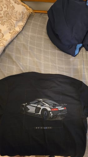 Reviewer's black 80Eighty DCG89 shirt laid out, showing the large sports car graphic on the back.