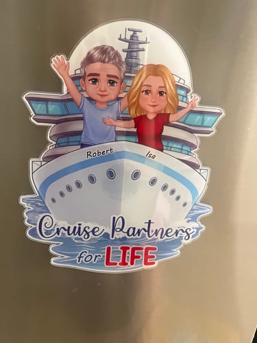 Customer's personalized cruise magnet on a metal door, showing a cartoon couple and text 'Cruise Partners for LIFE'.
