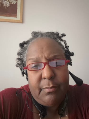 Reviewer's close-up photo showing a strained expression, submitted for their Migranium Daily review.