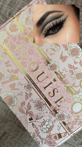 Reviewer's graphic eyeliner look with a glittery wing, shown with the Off The Record Eyeliner Palette packaging.