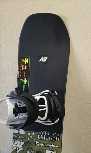 Customer's holographic GOLDEN NIGHTS SLAP sticker on a black snowboard.
