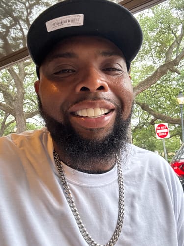 Customer showing a confident, bright smile while wearing their Pop On Veneers.