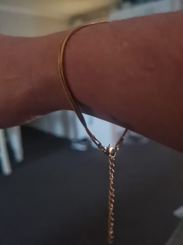 Customer wearing the Forever Knot Bracelet, showing its loose fit on their wrist.