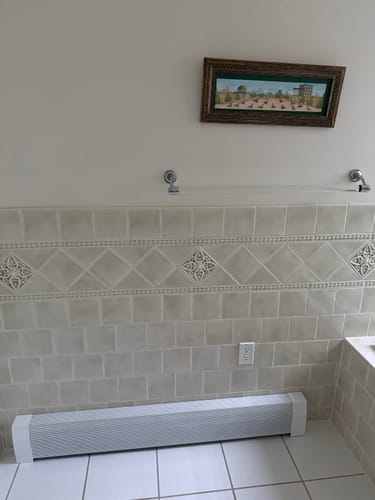 Customer photo review of Standard White Baseboard Covers by the Foot
