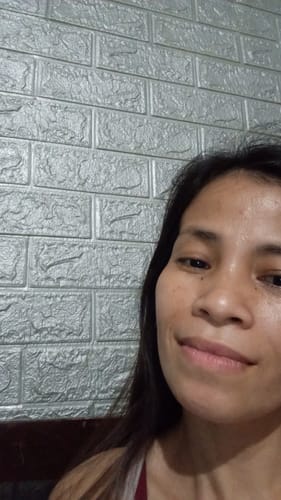 Reviewer's face, showing her skin after using the Bad Skin™ Collagen Ampoule.