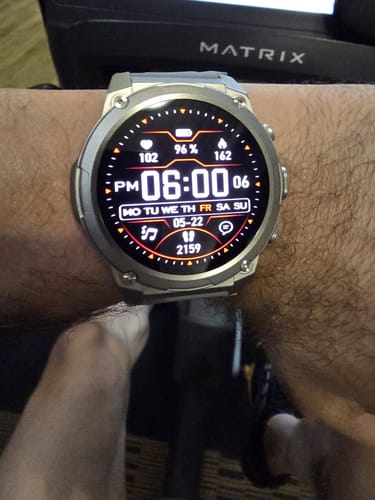 Customer's silver Gard Pro Ultra 3 on their wrist. The digital watch face displays time and various fitness stats.