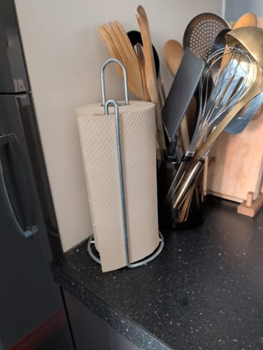 Customer's Unbleached Bamboo Kitchen Roll on a stand on a dark kitchen counter.