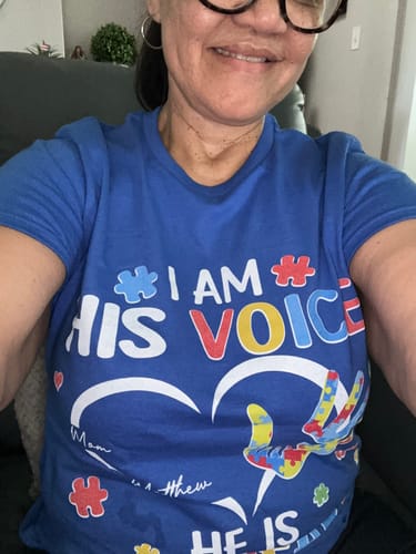 Reviewer wearing the blue 'I'm His Voice He's My Heart' personalized Autism Awareness shirt.