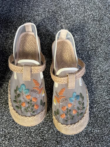 Customer's pair of vintage-style linen shoes with colorful flower embroidery.