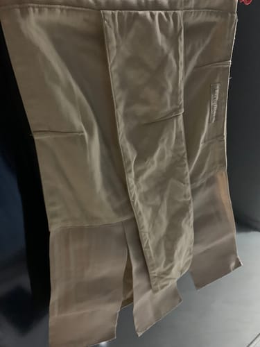 A customer's beige Lovemere Postpartum Tummy Wrap Binder showing its multiple adjustable panels.