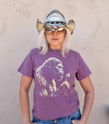 Reviewer wearing the purple Blowing Wishes T-Shirt showing the Bigfoot graphic.