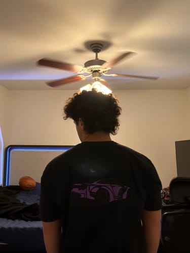 Reviewer from behind wearing the black 80Eighty® Limited Edition DCG88 Shirt, showing the purple graphic.