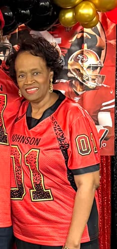 Reviewer wearing a custom red football jersey with the name JOHNSON and number 11 on the front.