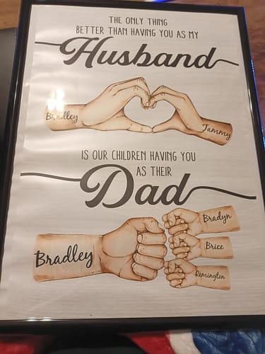 Reviewer's personalized "Husband Dad Hands" poster in a black frame, showing family names on illustrated hands.