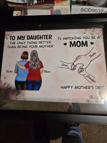Customer's personalized 'From Mom to Daughter' poster with the names Tasha, Zorii, and Londyn displayed on a table.