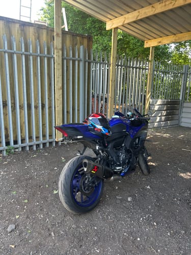 Customer's blue Yamaha R7 parked outdoors showing the installed sleek tail tidy from the rear.