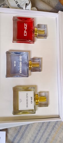 Customer's OUD Supreme BUNDLE showing the three different perfume bottles—Oud Nirvana, Oud Serene, and Zing—in a white box.