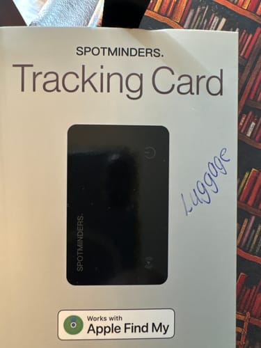 Customer's SPOTMINDERS Tracking Card in its packaging, with "Luggage" handwritten on the front.