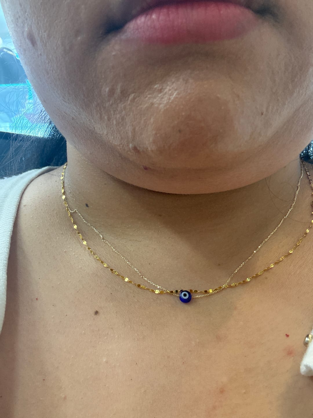Customer photo review of MYKONOS EVIL EYE BLUE NECKLACE