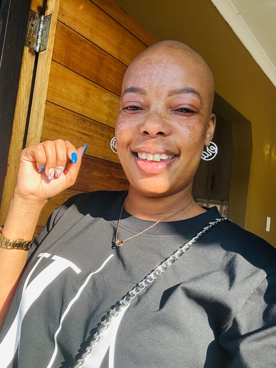 Customer photo review of Gold Luxe Mini Logo Hoops
