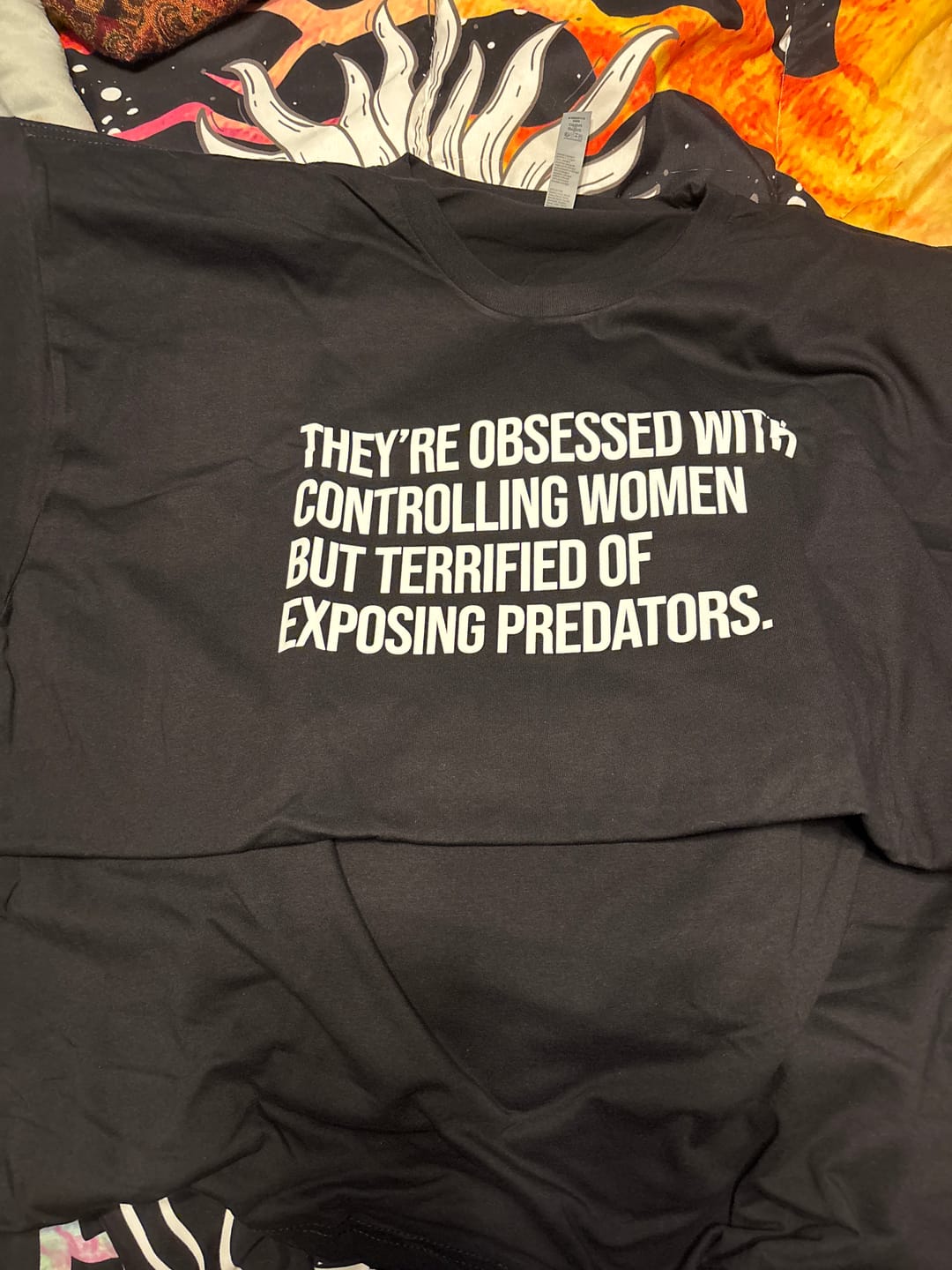 Customer photo review of They’re Obsessed with Controlling Women but Terrified of Exposing Predators Unisex Tee