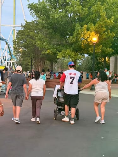 Reviewer from behind wearing a Dominican Republic Heritage Custom Baseball Jersey with the name "PASTOR" and the number "7" on the back.