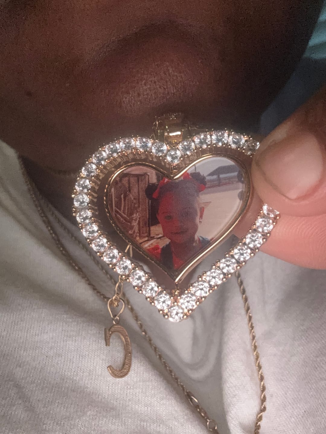 Customer photo review of Iced Heart Spinning Photo Pendant