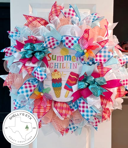 Customer's colorful summer wreath featuring the ivory, aqua, and fuchsia diamond ombre ribbon made into bows.