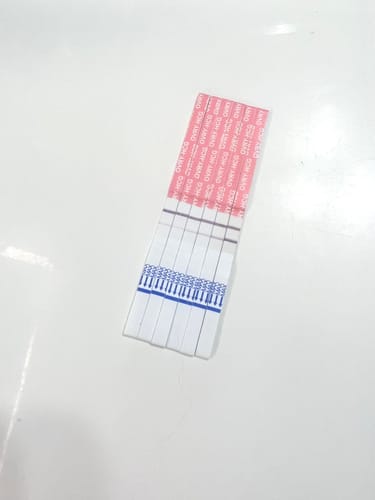Customer's collection of Pregnancy Test Strips from a review, showing a progression of test results.