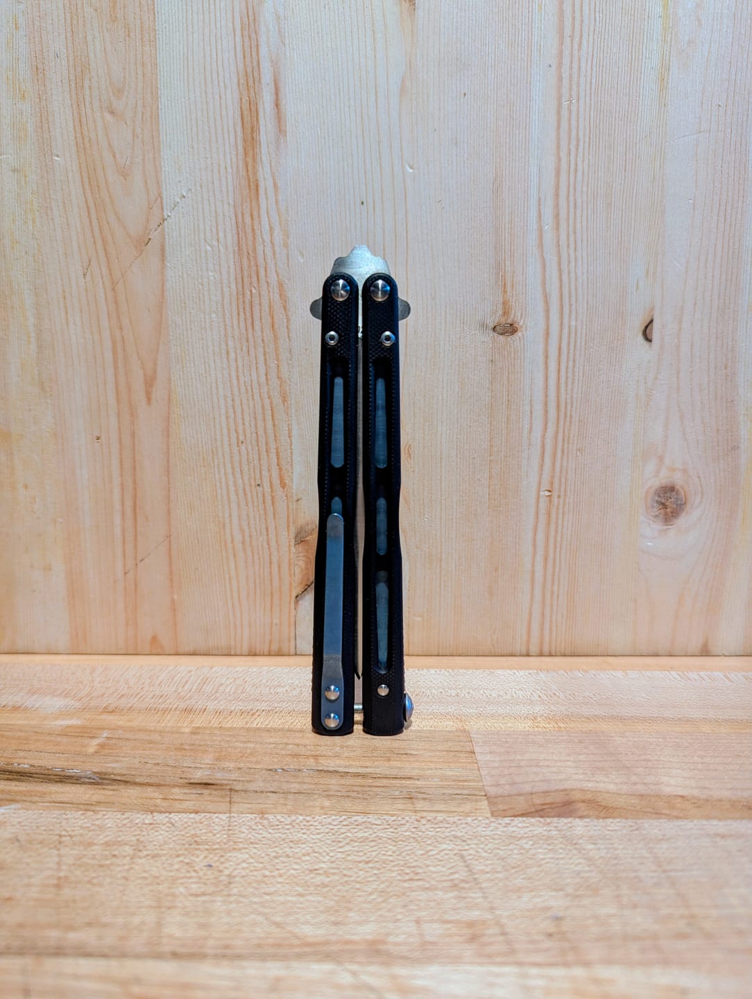 Customer photo review of THEONE BM51 Balisong Clone Titanium Alloy Handle D2 Tool Steel Stainless Steel Blade Bushing