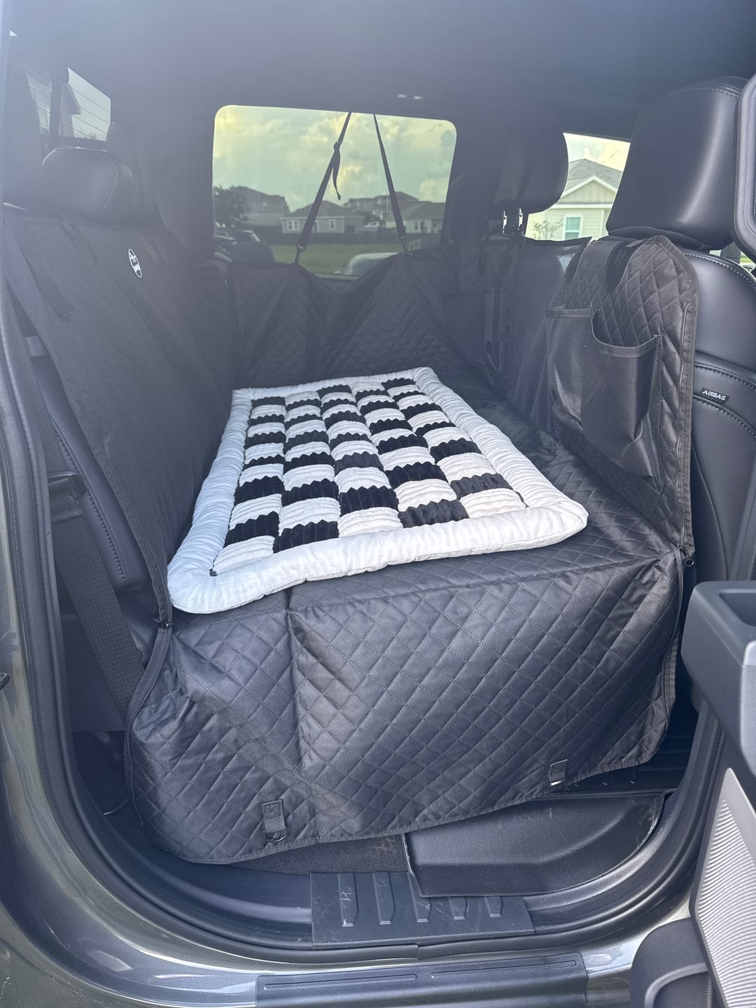 Customer photo review of NEW Waterproof Hard Bottom Car & Truck Seat Foldable Hammock Cover With Storage Pockets, Side Flaps, Headrest Straps, Seat Anchors, & Mesh Window (+FREE SAFETY BELT!)