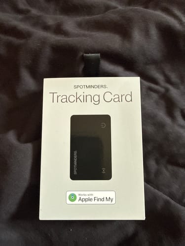 Customer's view of the SPOTMINDERS Tracking Card packaging, showing the slim black card and Apple Find My logo.