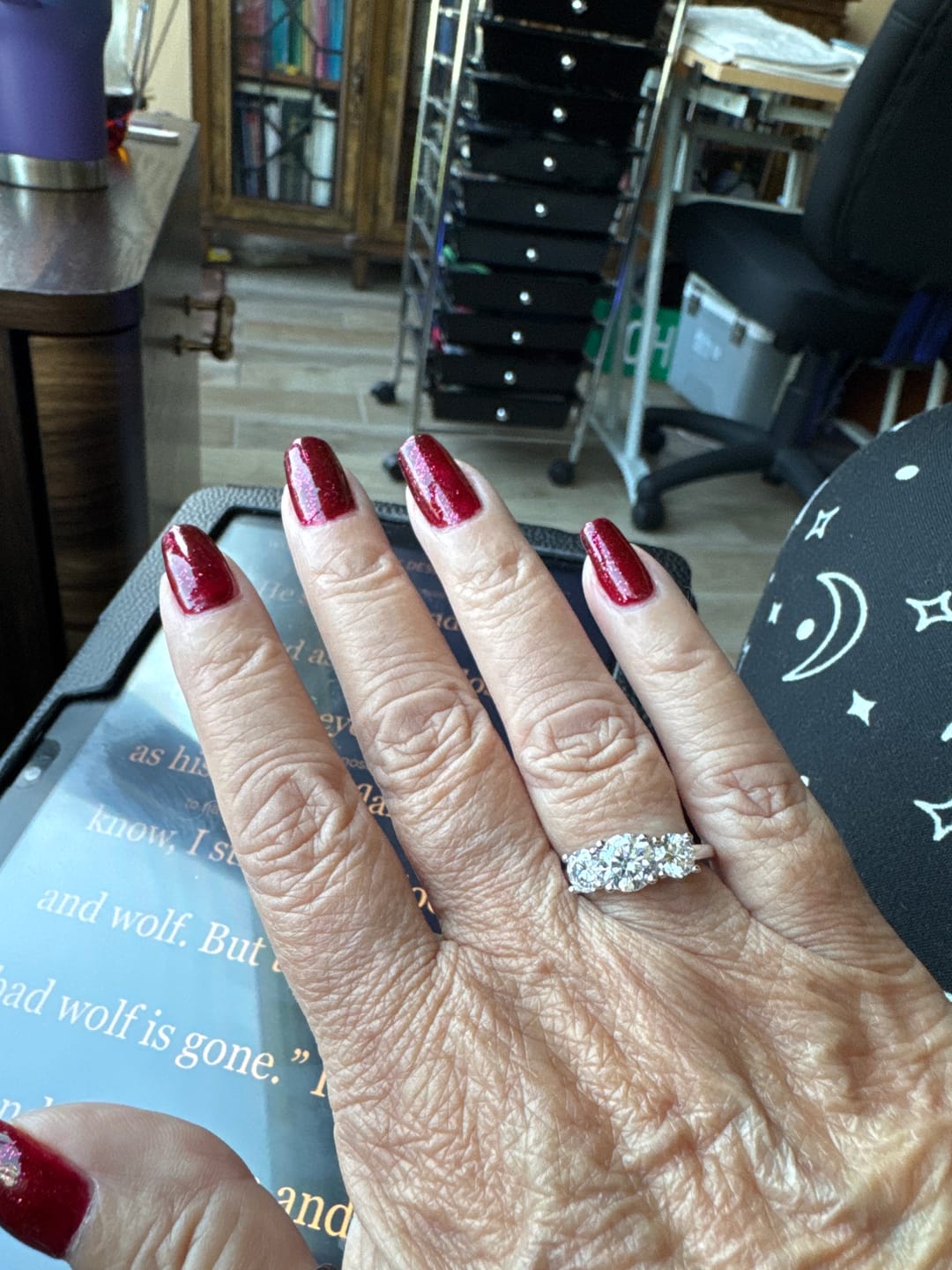 Customer photo review of Colored Round Moissanite Side Stone Engagement Ring