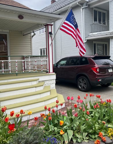Customer's beautiful Betsy Ross Flag displayed on their home's porch for Memorial Day.