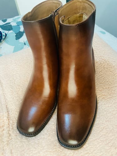 Customer's tan Miss Black Zuri 1 Ankle Boots in shiny faux leather standing on a soft surface.