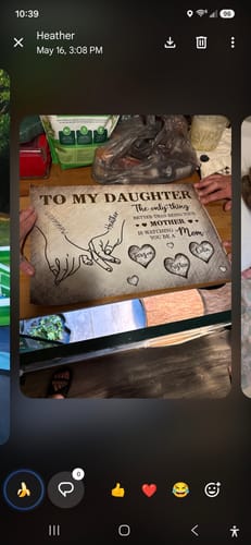 Customer holding up the personalized 'To My Daughter' poster, showing the custom hand-holding design.