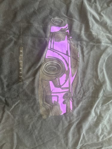 Customer's review photo showing the purple and black car graphic on their 80Eighty DCG88 shirt.