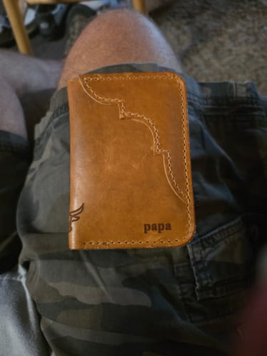 Customer's light brown leather Western Vertical Wallet, personalized with 'papa' on the front.