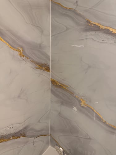 Customer photo review of Panneau Mural PVC Effet Marbre Doré – Étanche et facile à poser