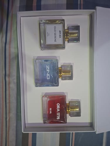 Customer's OUD Supreme BUNDLE showing the three different perfume bottles inside the open white box.