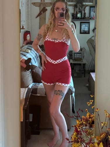 Customer takes a mirror selfie showing the front of the Red 1940s Halter Patchwork One-piece Swimsuit.