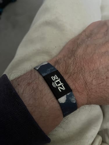 Close-up of a customer wearing the patterned In Loving Memory Bracelet on their wrist.