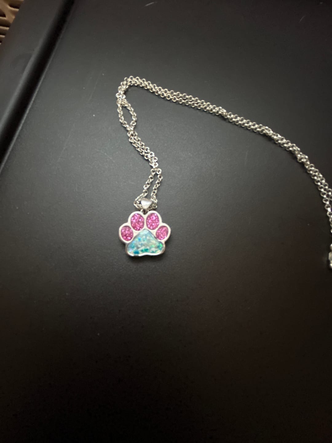 Customer photo review of Sparkle Toe Pawprint Pendant with Cremation Ashes