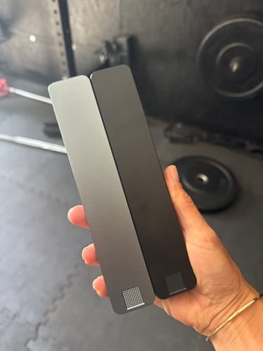 Customer holding the silver and black Weekly AM-PM Pill Case 2.0 side-by-side in their hand.