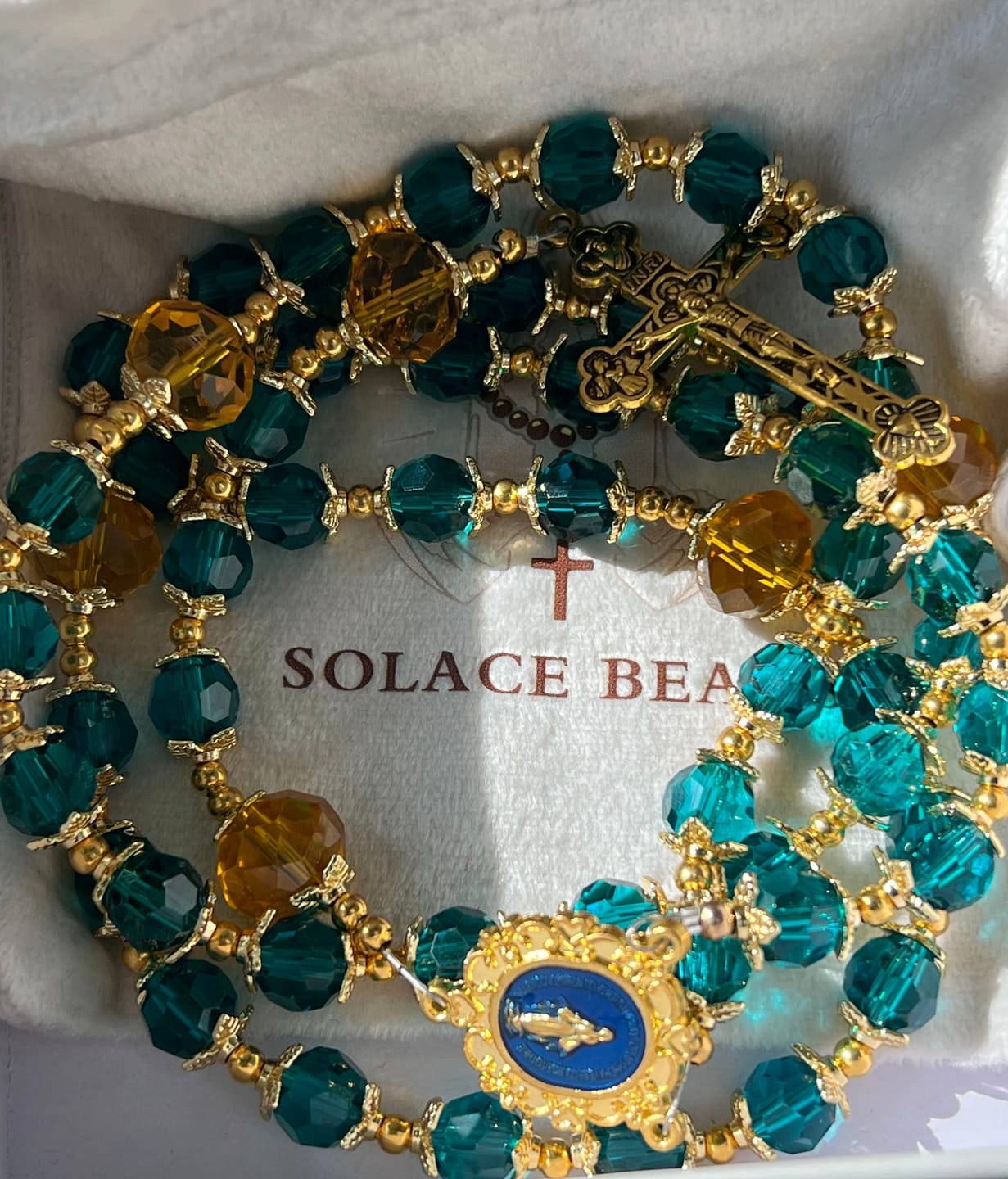 Customer photo review of SolaceBeads Peacock Blue & Champagne Crystal Rosary: A Prismatic Glow of Sacred Light