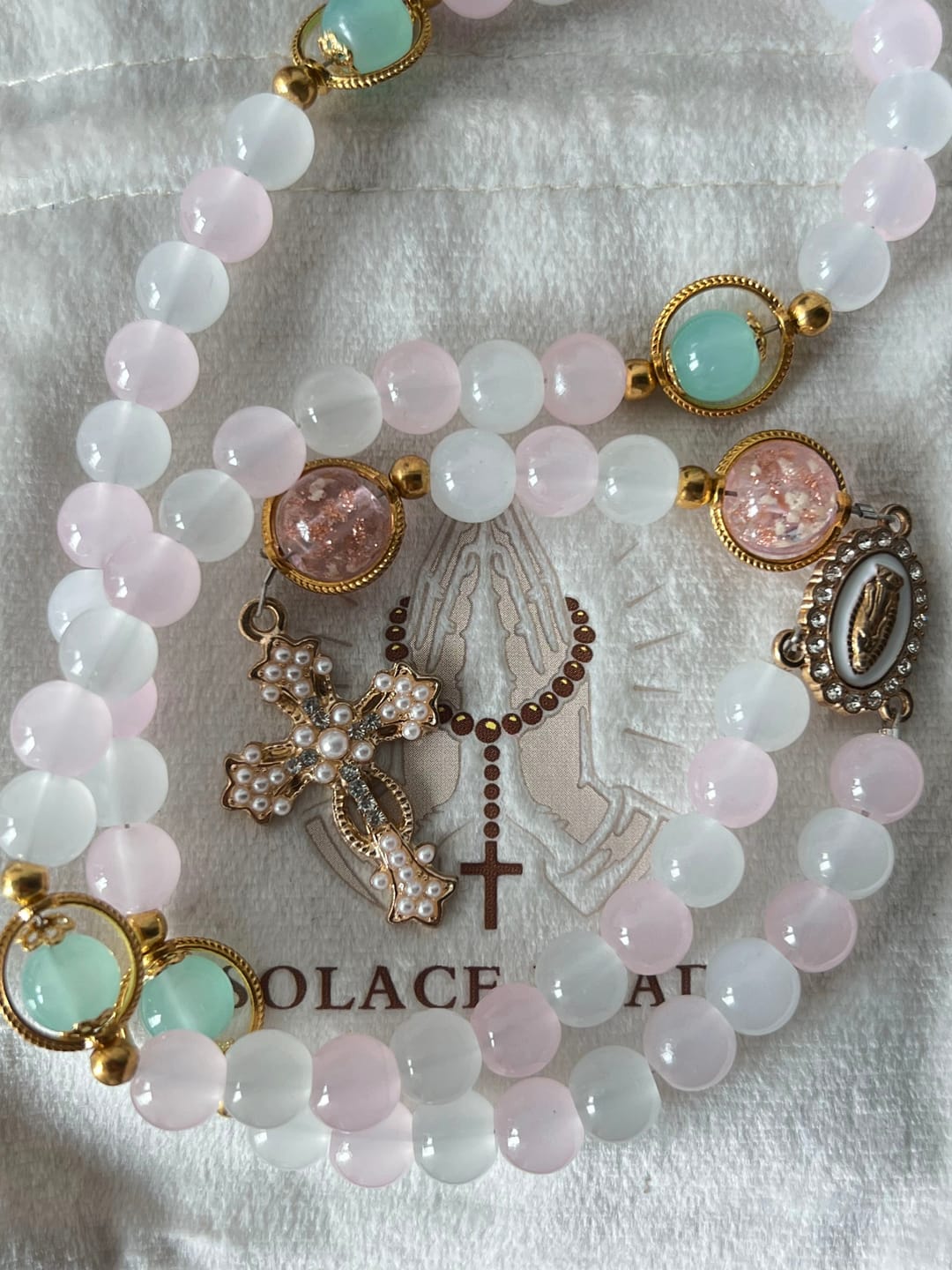 Customer photo review of SolaceBeads Artistic Pink & White Beaded Rosary: A Fusion of Colors & Sacred Symbols
