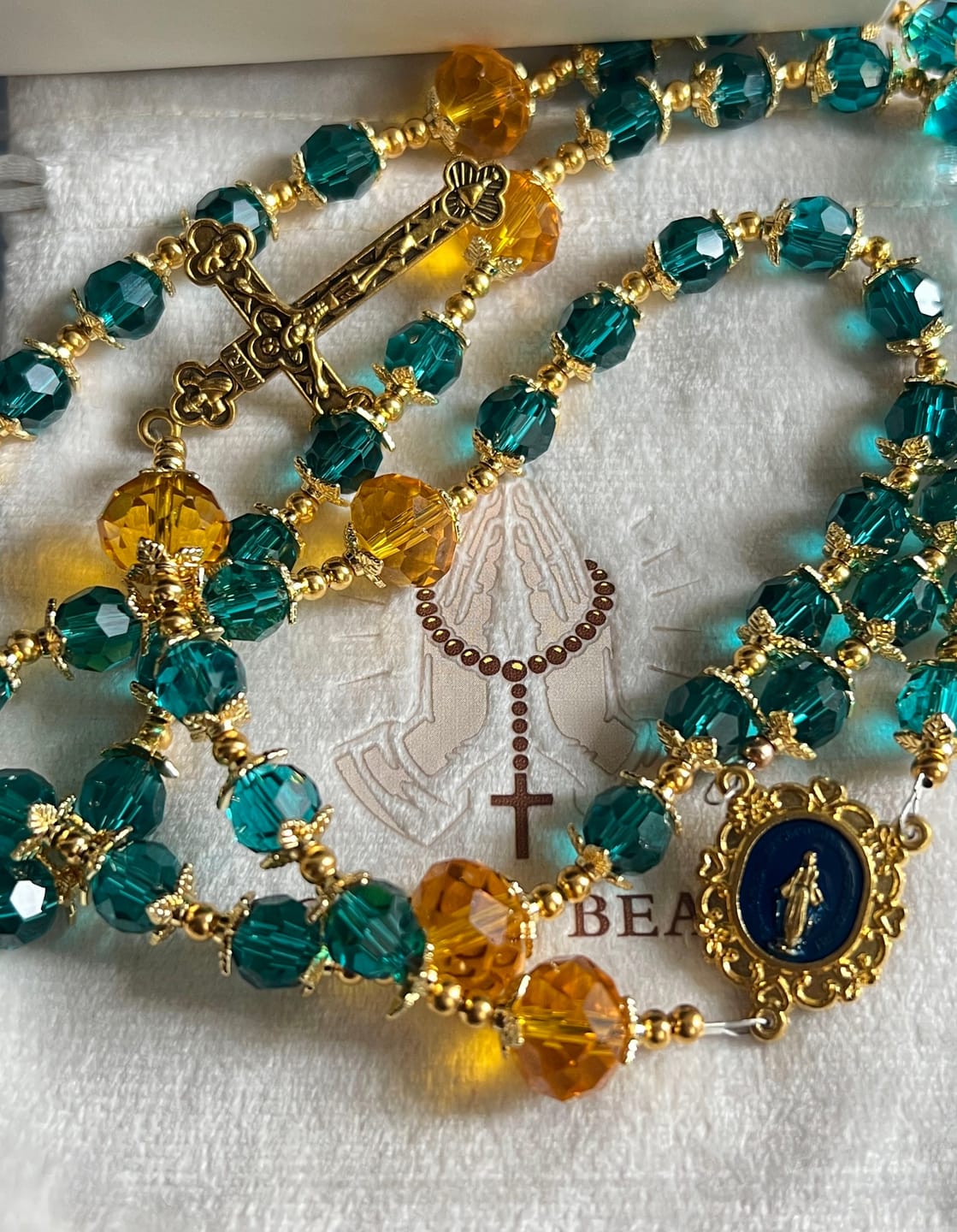 Customer photo review of SolaceBeads Peacock Blue & Champagne Crystal Rosary: A Prismatic Glow of Sacred Light